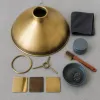 Luminaire en laiton, bronze ou or mat : les finitions qui s'assombrissent et comment les entretenir